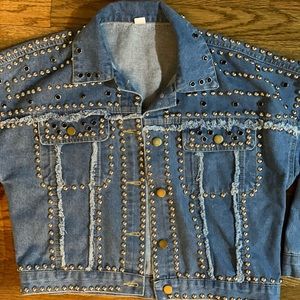 Studded denim jacket . Definitely a show stopper.
